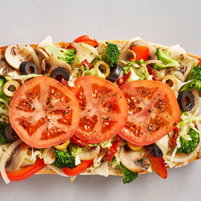 Field of dreams with artichoke hearts, broccoli, mushrooms, onions, red bell peppers, green and black olives, sun-dried tomatoes, mozzarella
