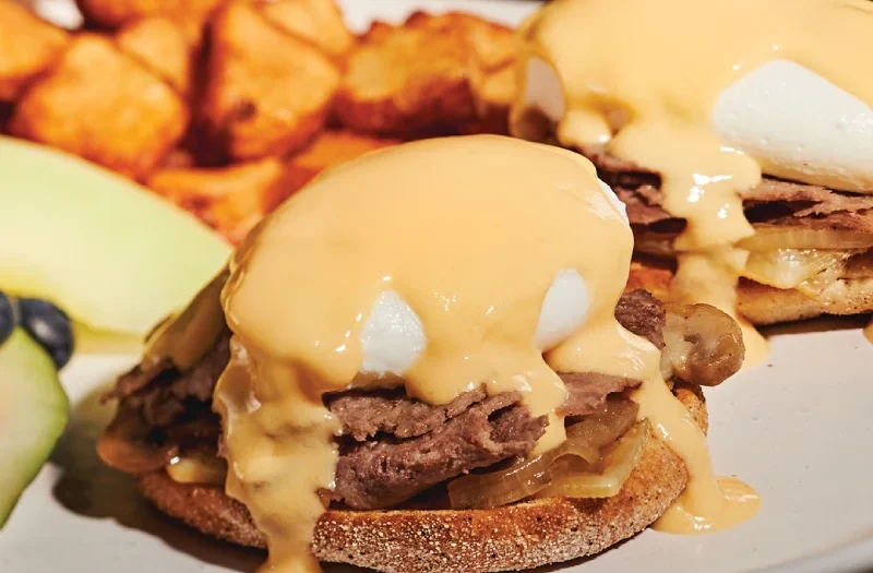 Philly, Poached egg(s) served on English muffins, topped with savoury Philly steak, onions, sautéed mushrooms, Cantonnier cheese and topped with