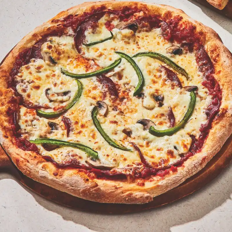 All-dressed pizza with signature pizza sauce, pepperoni, mushrooms, green peppers, and mozzarella pizza cheese