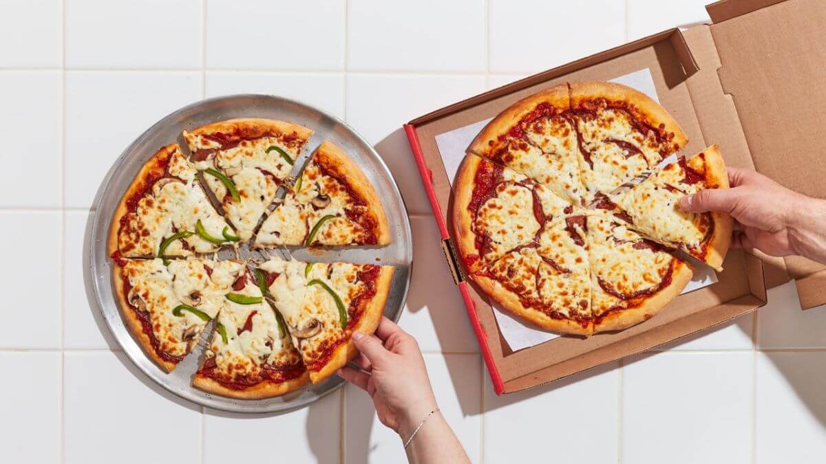 2 medium pizza in an open box for delivery