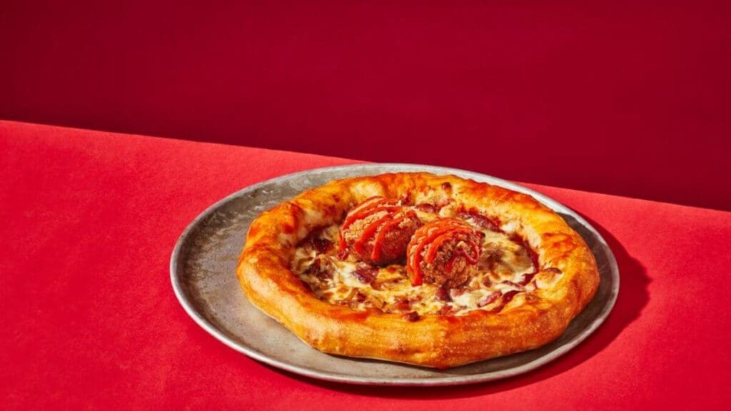 spicy Frank's RedHot® sauce pizza pompier topped with chicken bites and stuffed crust with cheese