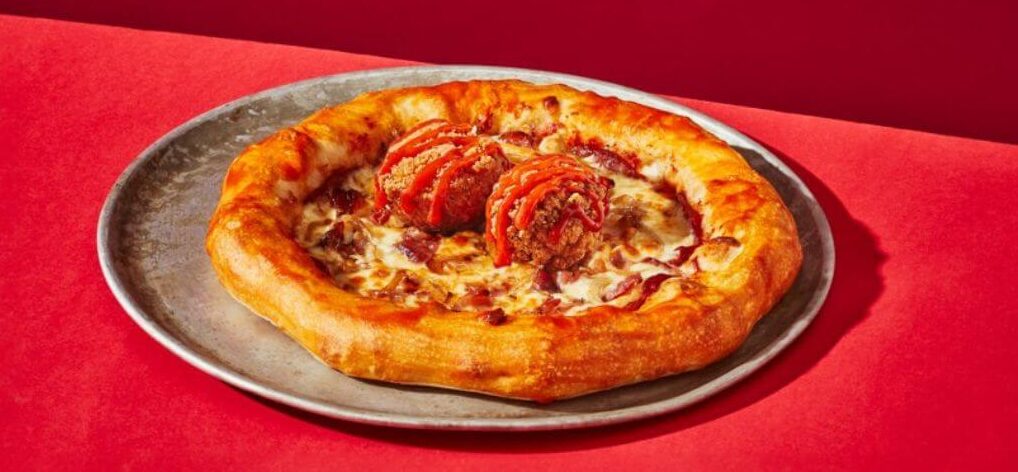spicy Frank's RedHot® sauce pizza pompier topped with chicken bites and stuffed crust with cheese