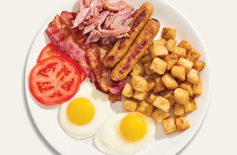 Egg with 3 choices of meat with 1 or 2 eggs with three choices between of bacon, sausages, pulled ham, cretons, or baked beans