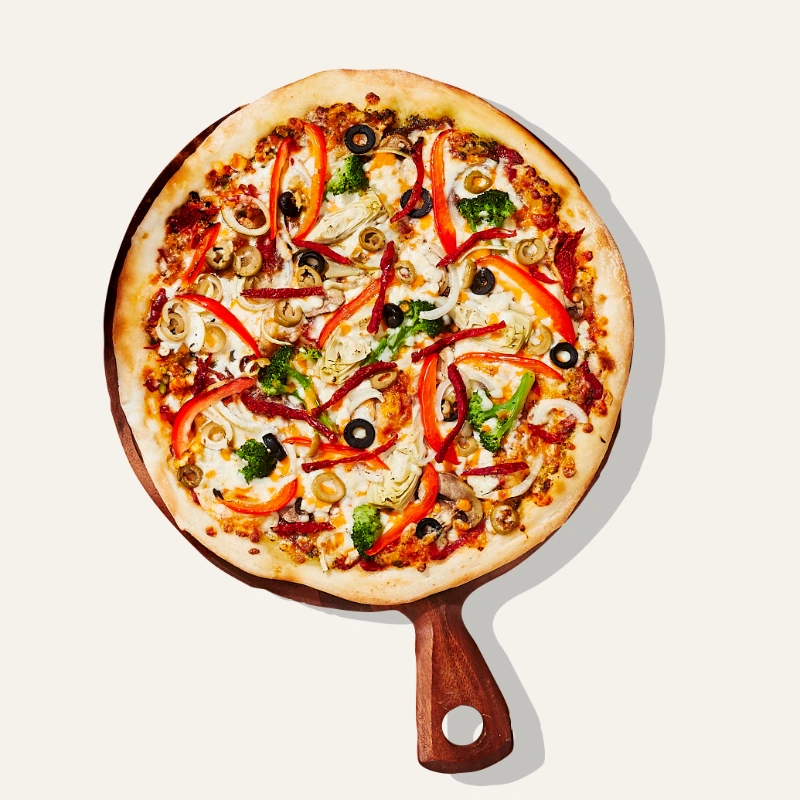 Field of dreams with artichoke hearts, broccoli, mushrooms, onions, red peppers, green and black olives, sun-dried tomatoes, mozzarella, fresh
